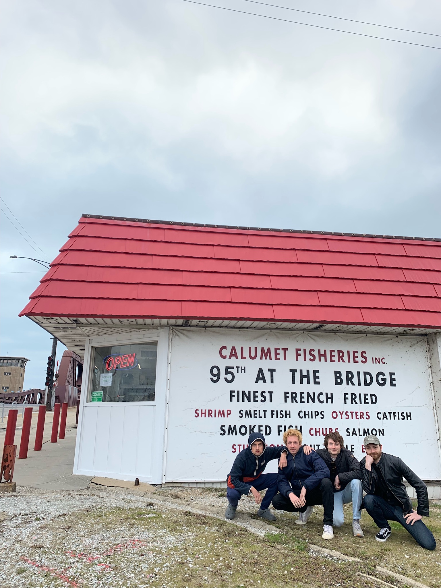 Lane Beckstrom, Liam Kazar, me, and Dorian Gehring posing in front of Calumet Fisheries in Chicago. Photo by Jack Henry.