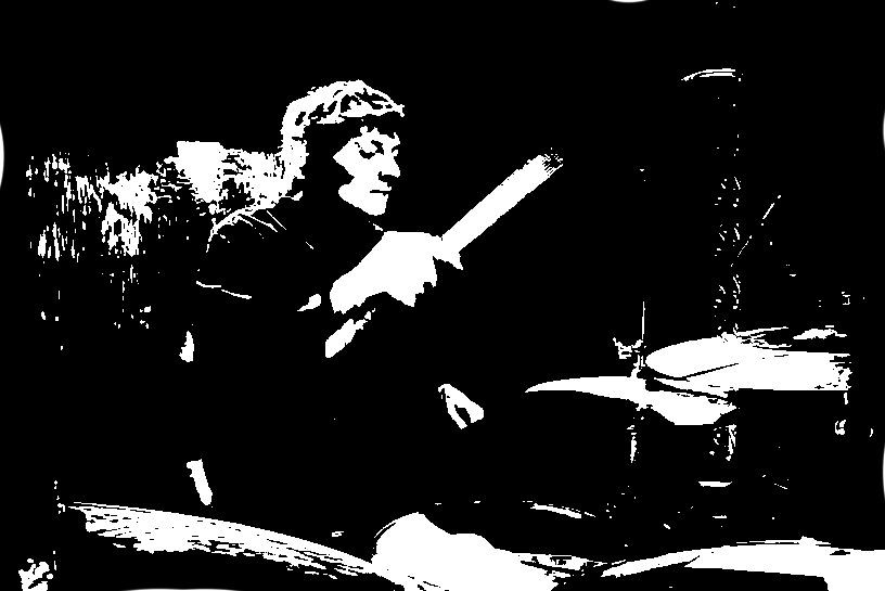 A black-and-white photo of me drumming